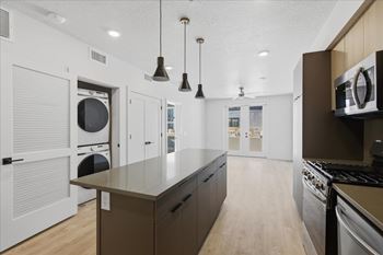 Modern kitchen with a large island and stainless steel appliances